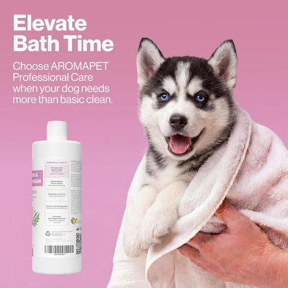 A white bottle of AROMAPET dog bath and shampoo is shown next to a husky puppy wrapped in a white towel on a solid pink background with promotional text.