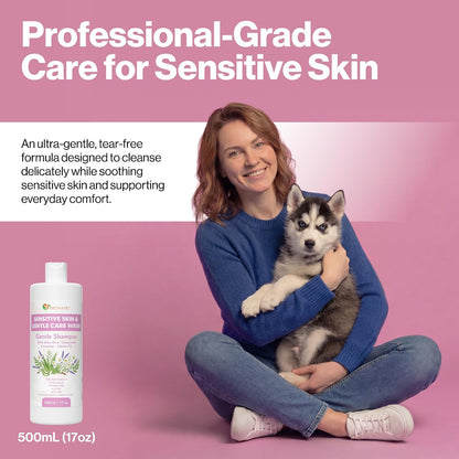 A woman sitting cross-legged on a pink background holds a husky puppy while promoting a pet skin care product. The image includes a bottle labeled 'Sensitive Skin & Itchy Skin Care Wash' and text reading 'Professional-Grade Care for Sensitive Skin' and '500mL (17oz)'.