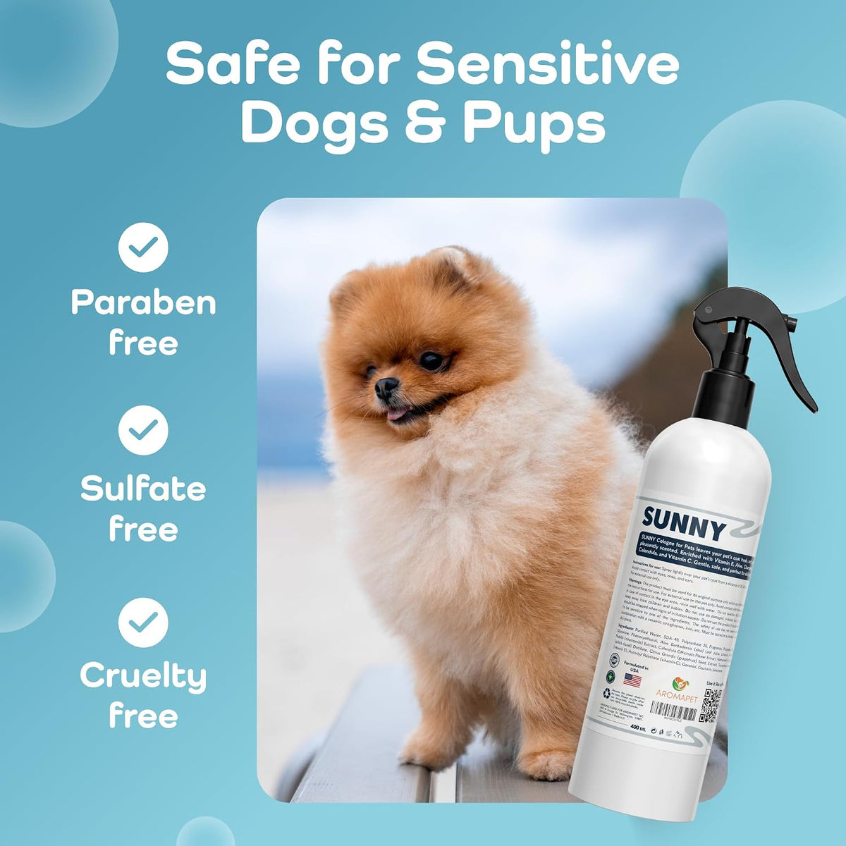 A pet grooming spray bottle labeled 'SUNNY' shown next to a fluffy cream Pomeranian dog on a light blue graphic background with text reading 'Safe for Sensitive Dogs & Pups,' 'Paraben free,' 'Sulfate free,' and 'Cruelty free.'.