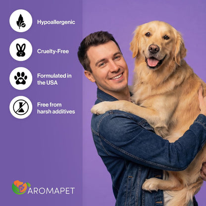 A smiling man in a denim jacket holds a golden retriever dog against a purple background with text badges reading Hypoallergenic, Cruelty-Free, Formulated in the USA, and Free from harsh additives. The AROMAPET logo appears at the bottom left.