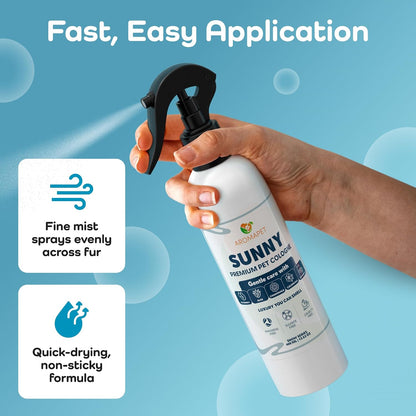 A hand holding a white spray bottle of ALEKOJIT Sunny Premium Pet Cologne with a black nozzle, set against a light blue background with promotional text and feature callouts.
