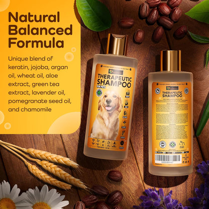 Two bottles of dog shampoo shown on a styled wooden surface with wheat, flowers, and cocoa beans. The left bottle shows the front label with a golden dog photo and the text 'THERAPEUTIC SHAMPOO'; the right bottle shows the back label.