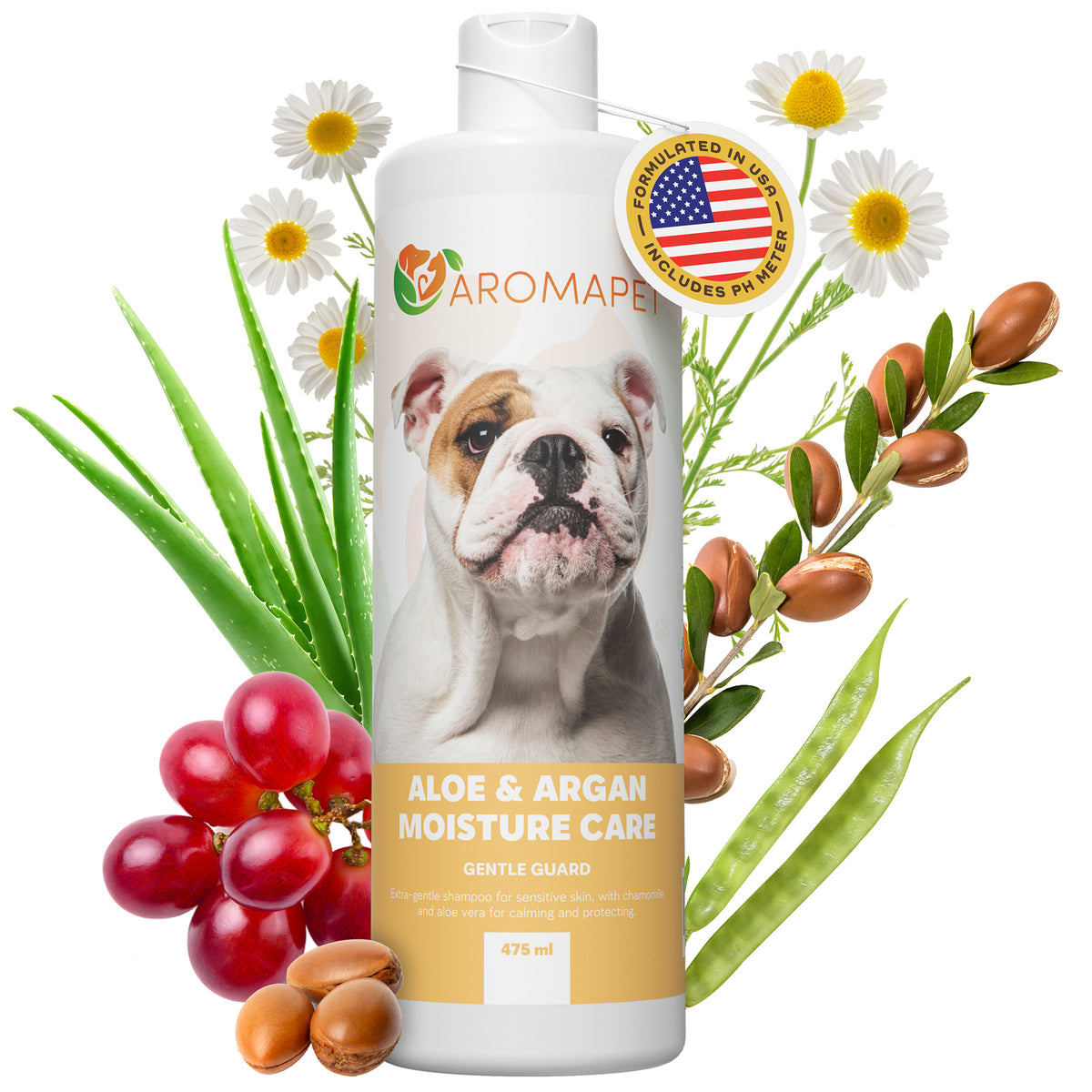 A bottle of Aromaper Aloe & Argan Moisture Care Gentle Guard, featuring a bulldog on the label, surrounded by fresh aloe vera leaves, red grapes, argan nuts, and white daisies on a white background.